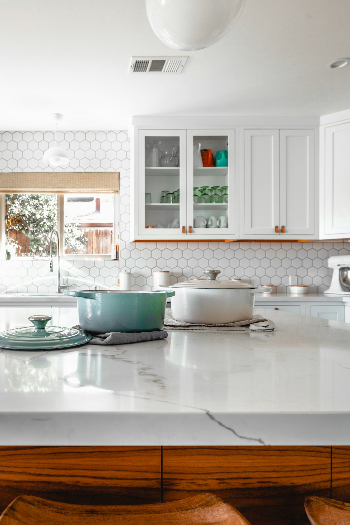 Bright remodeled kitchen with natural wood cabinets
