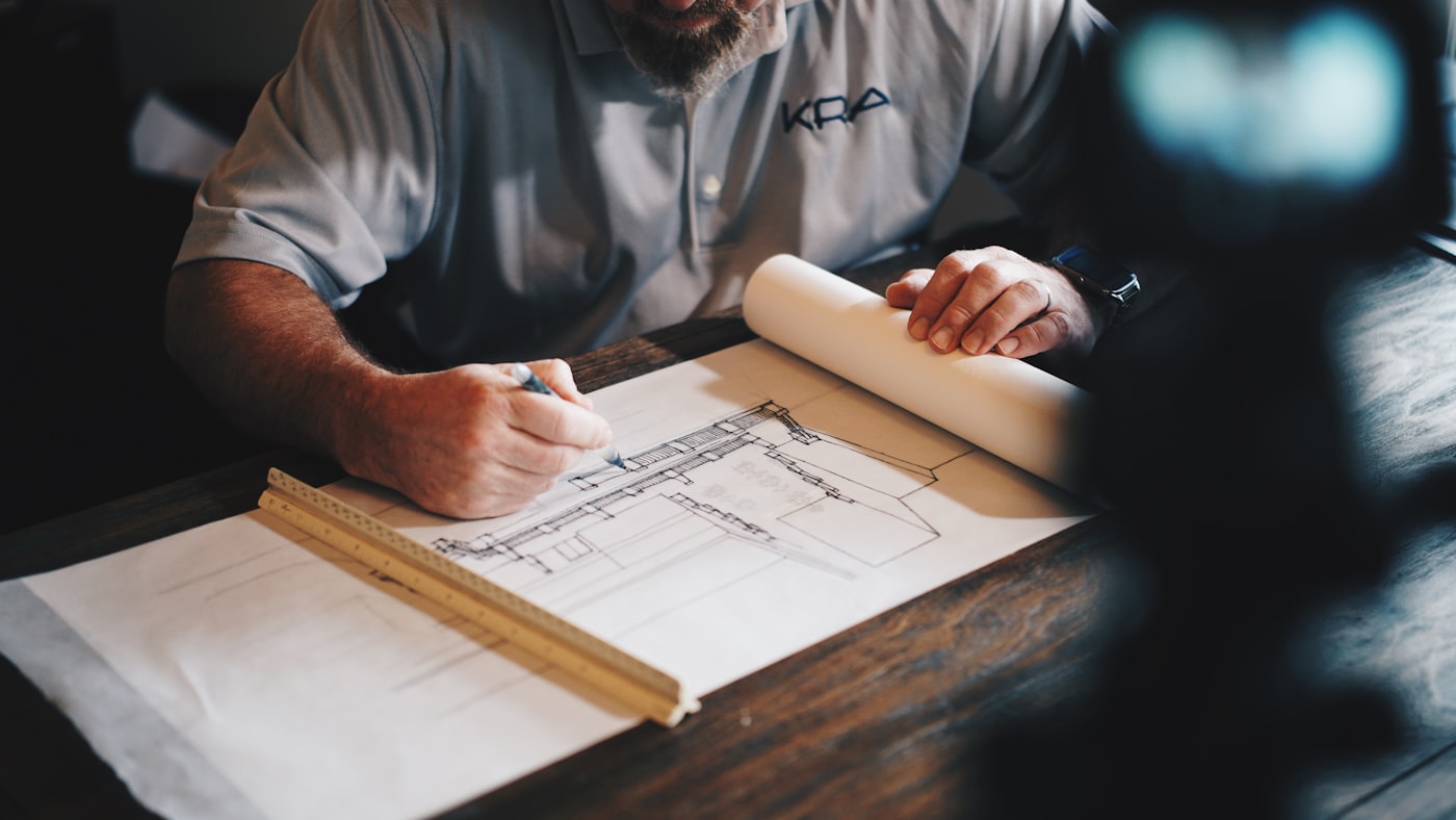 Craftsperson reviewing finish samples in a workshop